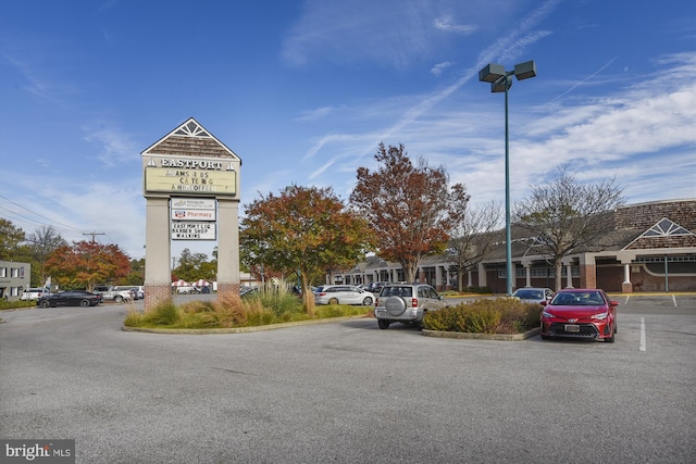view of building exterior with uncovered parking