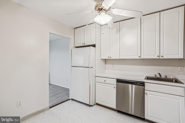 kitchen featuring stainless steel dishwasher, freestanding refrigerator, ceiling fan, and white cabinets