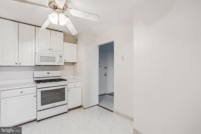 kitchen with white appliances, a ceiling fan, white cabinetry, and light countertops