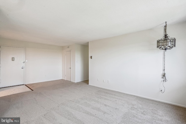 interior space with carpet floors and baseboards