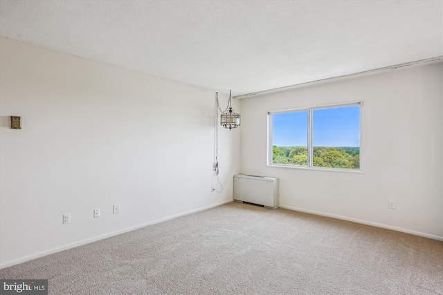 unfurnished room featuring baseboards and light colored carpet
