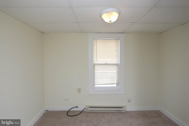 216 Clyde, Halethorpe, MD 21227 - carpeted spare room with baseboard heating, a paneled ceiling, and baseboards