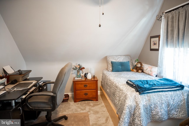 carpeted bedroom featuring vaulted ceiling