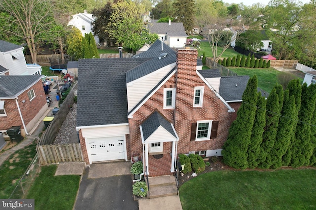 birds eye view of property with a residential view