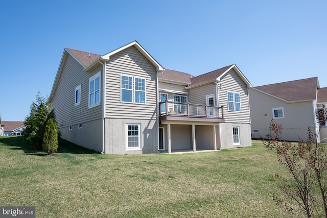 back of house with a lawn