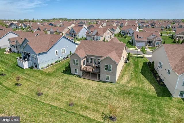 birds eye view of property with a residential view