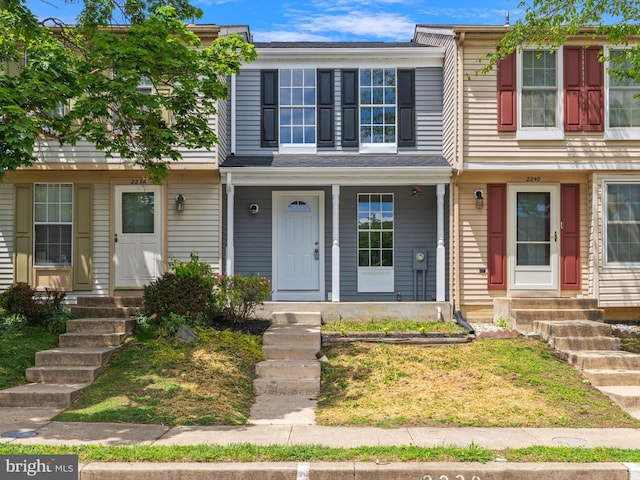 multi unit property featuring a porch