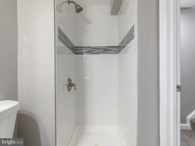 full bath with a shower stall and toilet