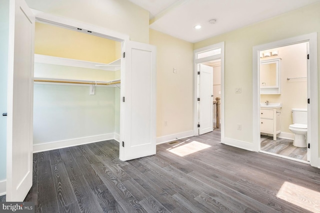 5308 5th NW, Washington, DC 20011 - unfurnished bedroom with dark wood-type flooring, recessed lighting, a closet, and connected bathroom