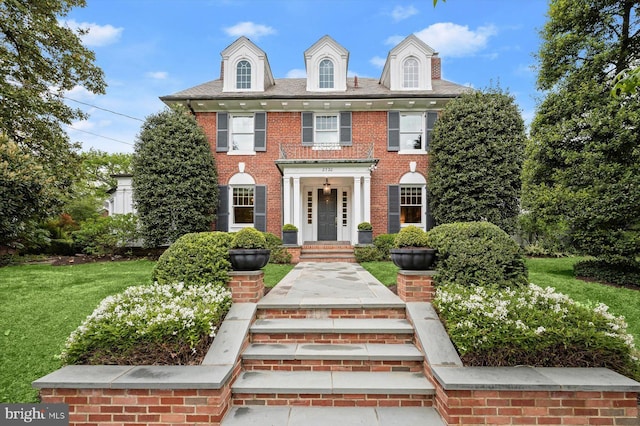 2720 35th Pl NW, Washington, DC 20007 - colonial home with brick siding and a front lawn