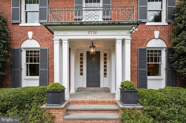 2720 35th Pl NW, Washington, DC 20007 - view of exterior entry with brick siding and a balcony
