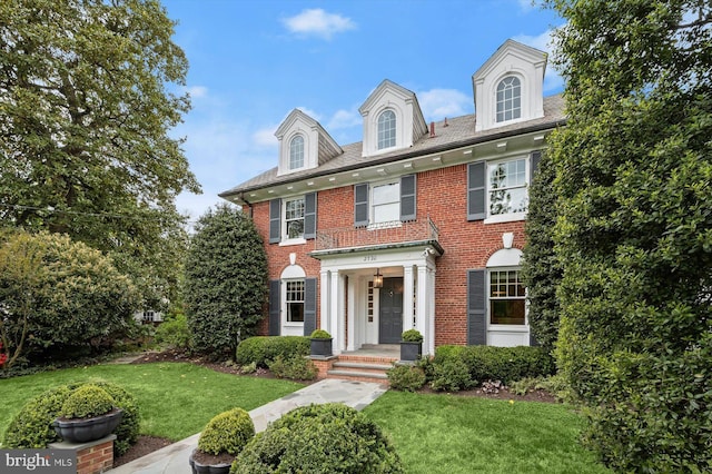 2720 35th Pl NW, Washington, DC 20007 - colonial inspired home with a front lawn and brick siding