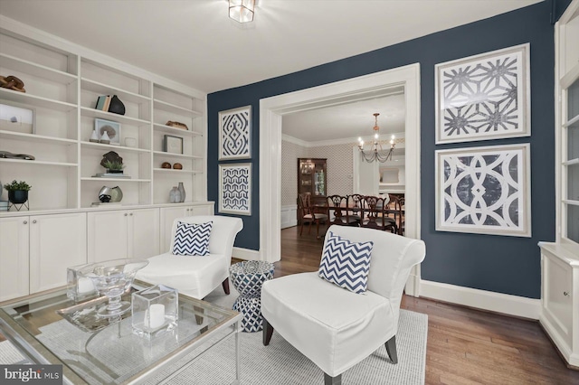 2720 35th Pl NW, Washington, DC 20007 - sitting room with wood finished floors, a chandelier, ornamental molding, baseboards, and a wainscoted wall
