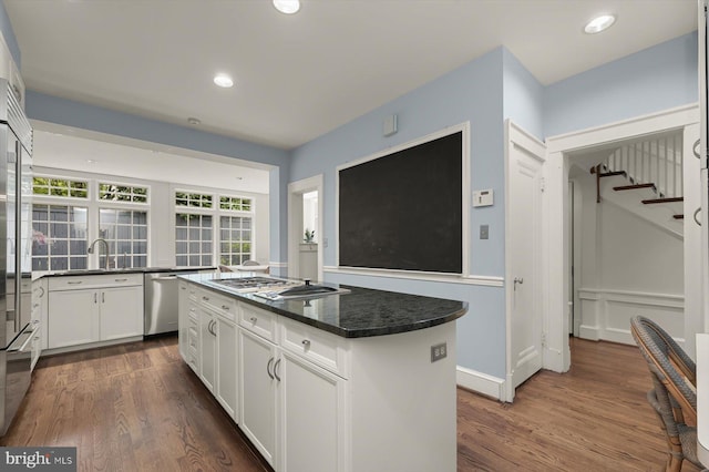 2720 35th Pl NW, Washington, DC 20007 - kitchen with appliances with stainless steel finishes, a center island, dark wood-type flooring, white cabinets, and recessed lighting