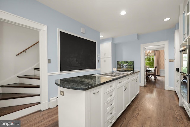 2720 35th Pl NW, Washington, DC 20007 - kitchen with white cabinetry, dark wood-style flooring, dark stone counters, stainless steel gas cooktop, and recessed lighting