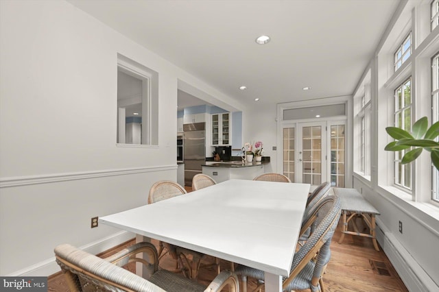 2720 35th Pl NW, Washington, DC 20007 - dining area featuring baseboard heating, wood finished floors, recessed lighting, and baseboards