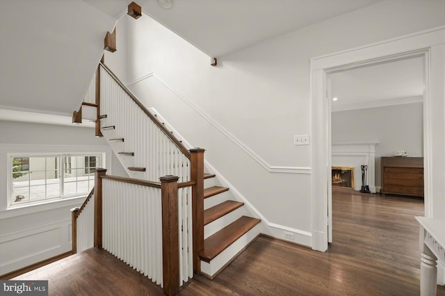 2720 35th Pl NW, Washington, DC 20007 - staircase featuring wood finished floors and a glass covered fireplace