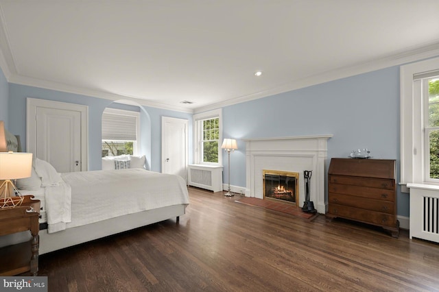2720 35th Pl NW, Washington, DC 20007 - bedroom with ornamental molding, radiator heating unit, wood finished floors, and multiple windows