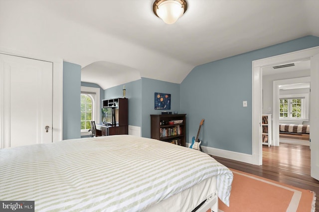 2720 35th Pl NW, Washington, DC 20007 - bedroom with lofted ceiling, wood finished floors, and baseboards