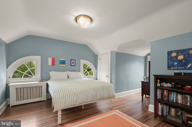 2720 35th Pl NW, Washington, DC 20007 - bedroom featuring radiator, vaulted ceiling, wood finished floors, and baseboards