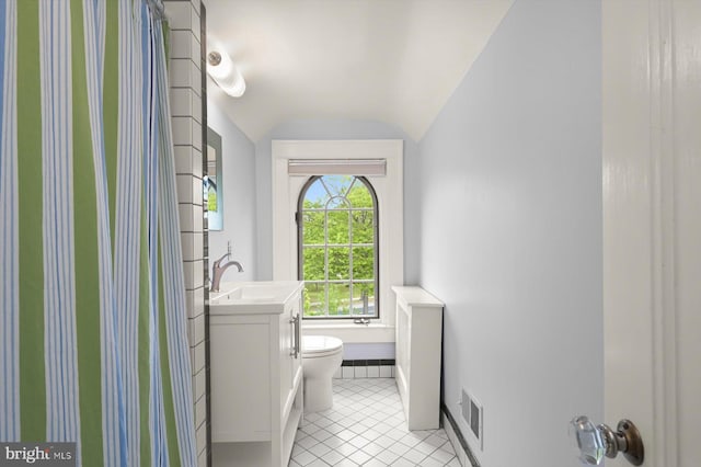 2720 35th Pl NW, Washington, DC 20007 - full bathroom with lofted ceiling, toilet, vanity, tile patterned flooring, and a tub