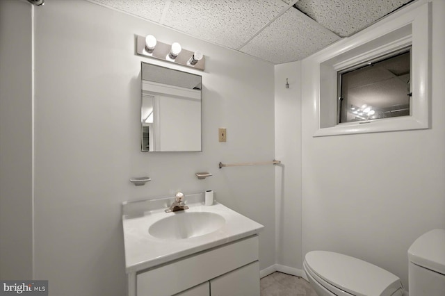 2720 35th Pl NW, Washington, DC 20007 - bathroom featuring a drop ceiling, toilet, and vanity