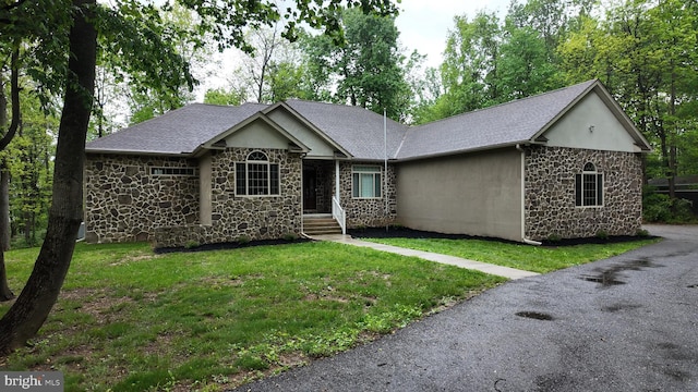 1982 Whyte Ln, Spring Grove, PA 17362 - single story home with stone siding, stucco siding, a front yard, and a shingled roof