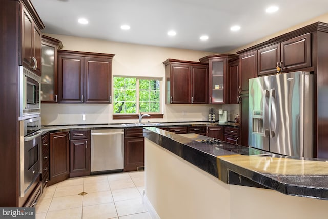 1982 Whyte Ln, Spring Grove, PA 17362 - kitchen featuring stainless steel appliances, a sink, glass insert cabinets, light tile patterned flooring, and recessed lighting