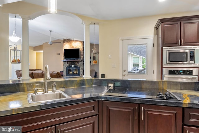 1982 Whyte Ln, Spring Grove, PA 17362 - kitchen with appliances with stainless steel finishes, ornate columns, a sink, vaulted ceiling, and dark countertops