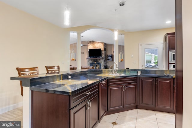 1982 Whyte Ln, Spring Grove, PA 17362 - kitchen with a sink, ornate columns, arched walkways, pendant lighting, and a fireplace