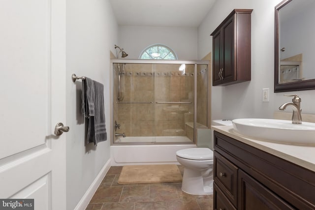 1982 Whyte Ln, Spring Grove, PA 17362 - full bath with toilet, vanity, combined bath / shower with glass door, and baseboards