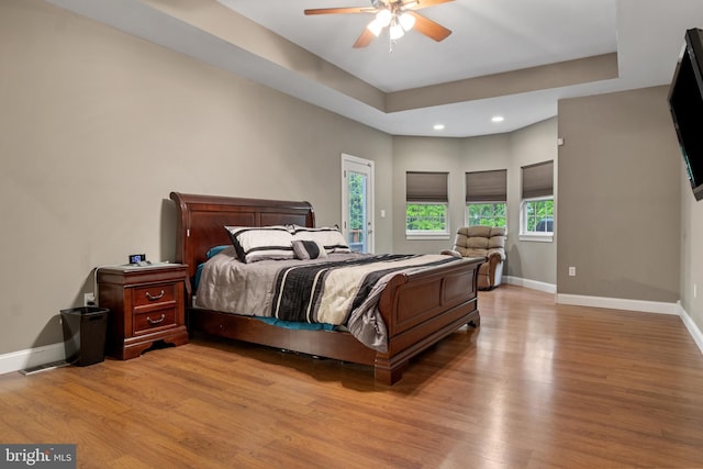 1982 Whyte Ln, Spring Grove, PA 17362 - bedroom featuring light wood-style flooring, recessed lighting, baseboards, ceiling fan, and a tray ceiling