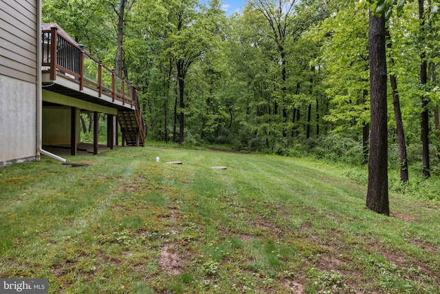 1982 Whyte Ln, Spring Grove, PA 17362 - view of grassy yard featuring stairway, a wooden deck, and a view of trees