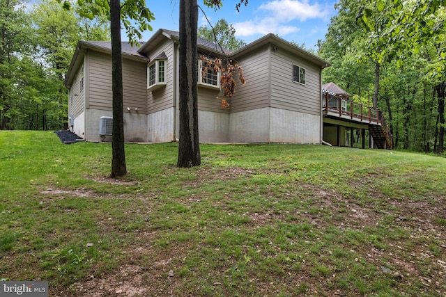 1982 Whyte Ln, Spring Grove, PA 17362 - view of side of home with a deck, a yard, central AC unit, and stairway
