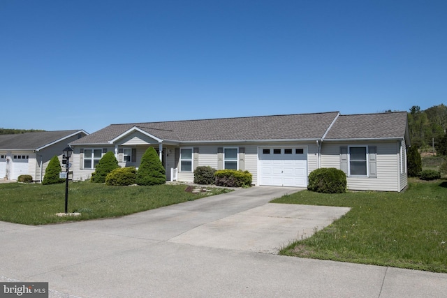359 Towpath Ln, Pine Grove, PA 17963 - single story home with an attached garage, a front lawn, roof with shingles, and concrete driveway