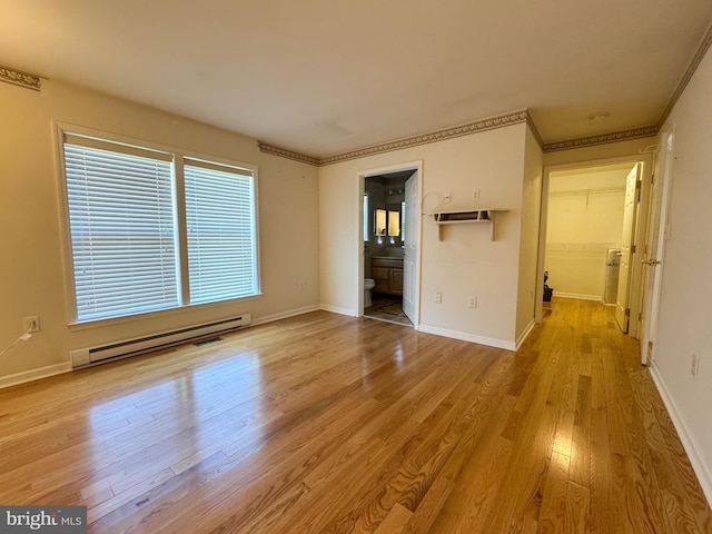 359 Towpath Ln, Pine Grove, PA 17963 - unfurnished room featuring baseboards, a baseboard heating unit, and wood finished floors