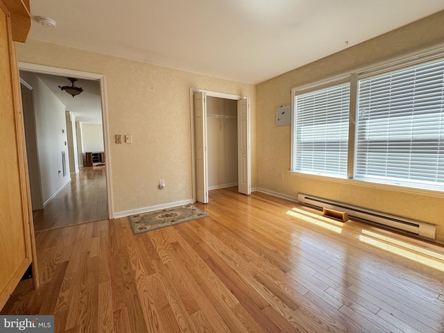 359 Towpath Ln, Pine Grove, PA 17963 - unfurnished bedroom with a closet, baseboards, a baseboard heating unit, and light wood-type flooring
