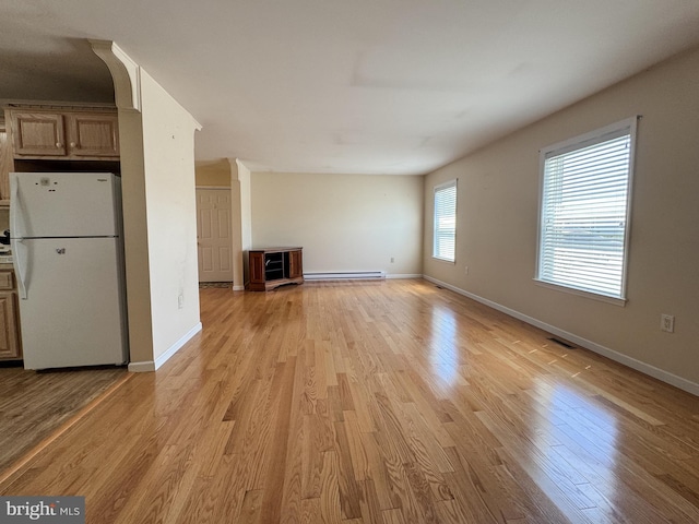 359 Towpath Ln, Pine Grove, PA 17963 - unfurnished living room featuring light wood-style floors, baseboards, a baseboard heating unit, and visible vents