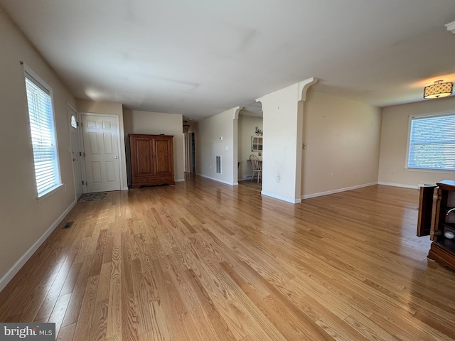 359 Towpath Ln, Pine Grove, PA 17963 - unfurnished living room with baseboards, plenty of natural light, light wood-style flooring, and visible vents