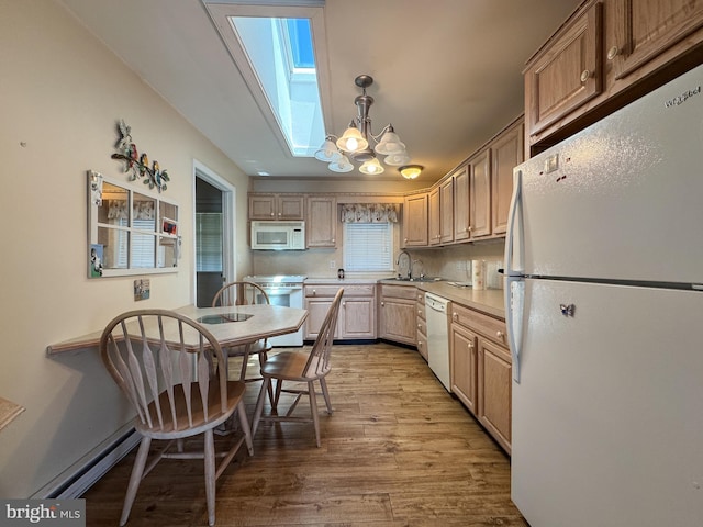 359 Towpath Ln, Pine Grove, PA 17963 - kitchen featuring light countertops, a baseboard radiator, light wood finished floors, a chandelier, and white appliances
