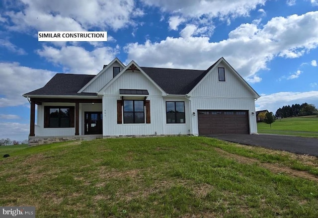 modern inspired farmhouse featuring a garage, a front yard, roof with shingles, board and batten siding, and driveway