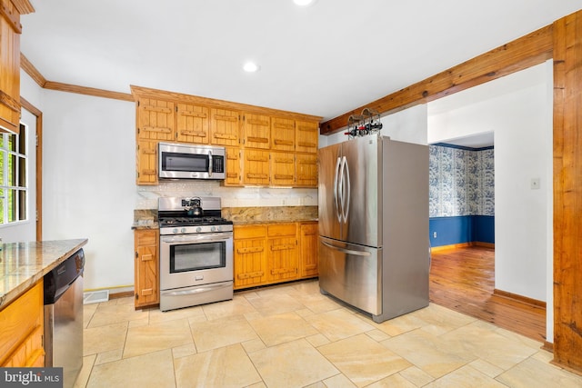 kitchen with stainless steel appliances, baseboards, backsplash, recessed lighting, and light stone finish floors