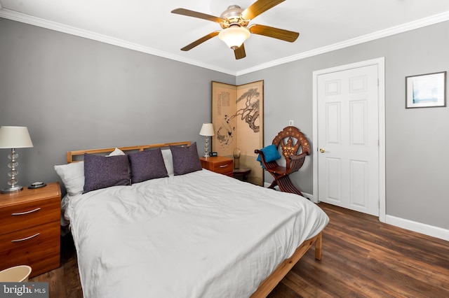 bedroom featuring crown molding, baseboards, ceiling fan, and wood finished floors