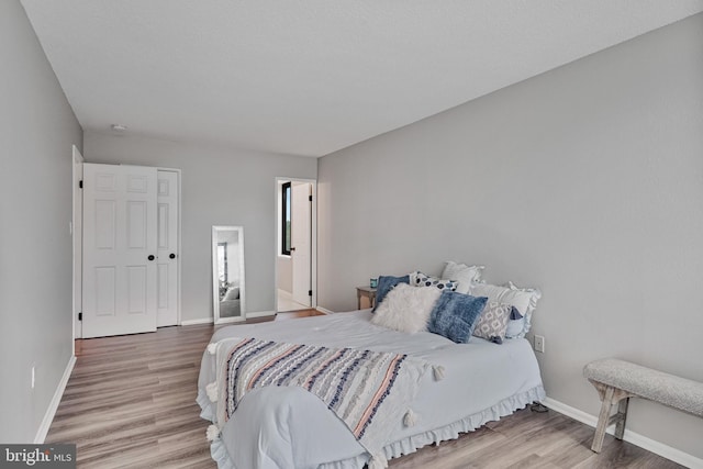 16 S Van Dorn St Unit 406, Alexandria, VA 22304 - bedroom with baseboards and wood finished floors