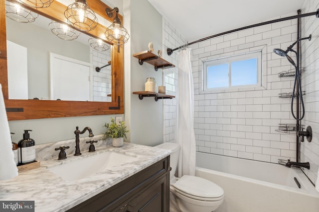 bathroom with vanity, shower / bath combo with shower curtain, and toilet