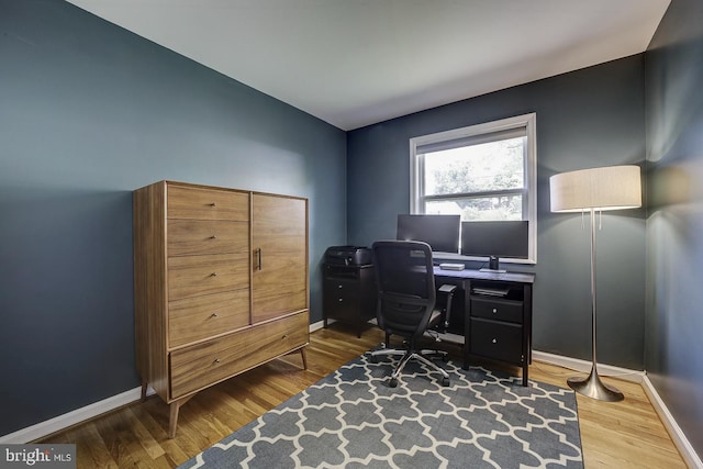 office area with wood finished floors and baseboards