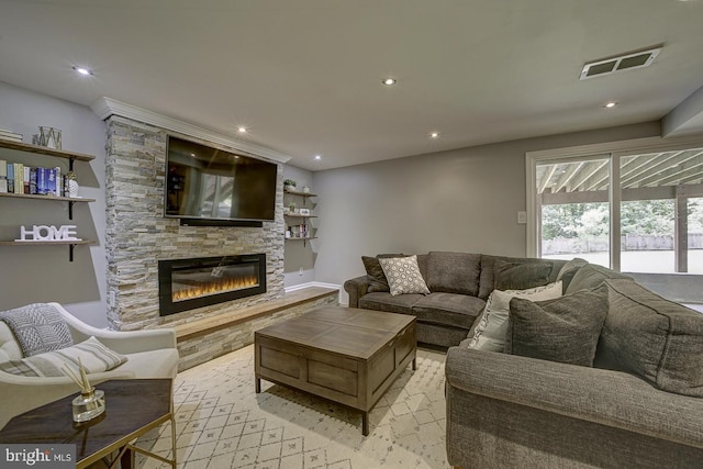 living area with a fireplace and recessed lighting