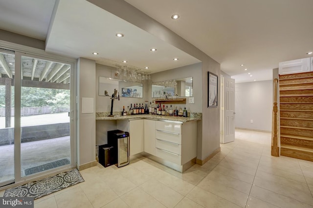 indoor wet bar with stairs, recessed lighting, light tile patterned floors, and baseboards