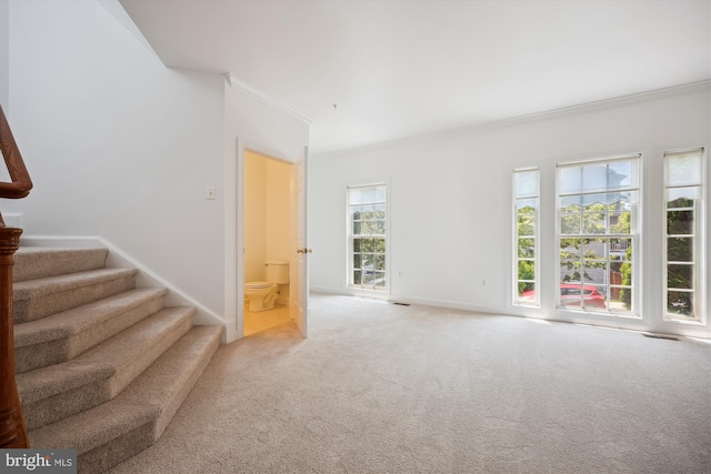 13901 Chatterly Pl, Germantown, MD 20874 - unfurnished living room featuring ornamental molding, stairs, and carpet