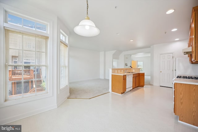 13901 Chatterly Pl, Germantown, MD 20874 - kitchen featuring white appliances, brown cabinets, a peninsula, healthy amount of natural light, and recessed lighting